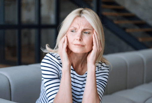 Women suffering from headaches due to perimenopause